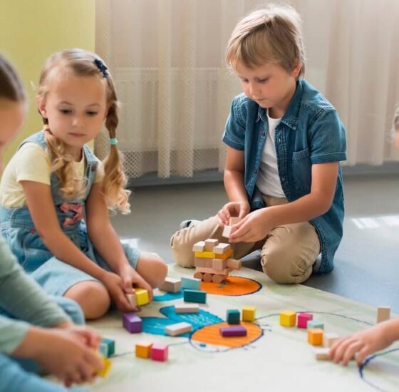 front-view-children-playing-together-kindergarten (1)